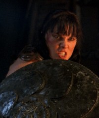 Xena defending herself with a shield