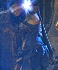 Xena ducking awy from the fire bolts