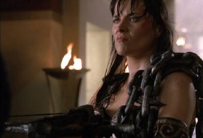 Xena holds a crossbow on Ares